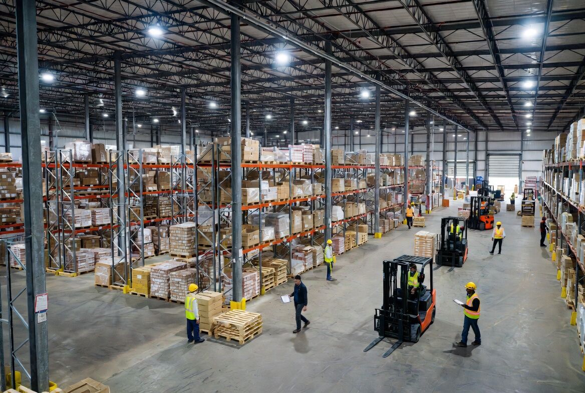 Warehouse team reviewing freight and inventory